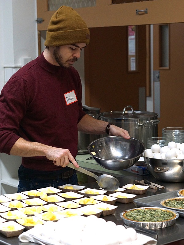 breakfast program volunteer preparing food