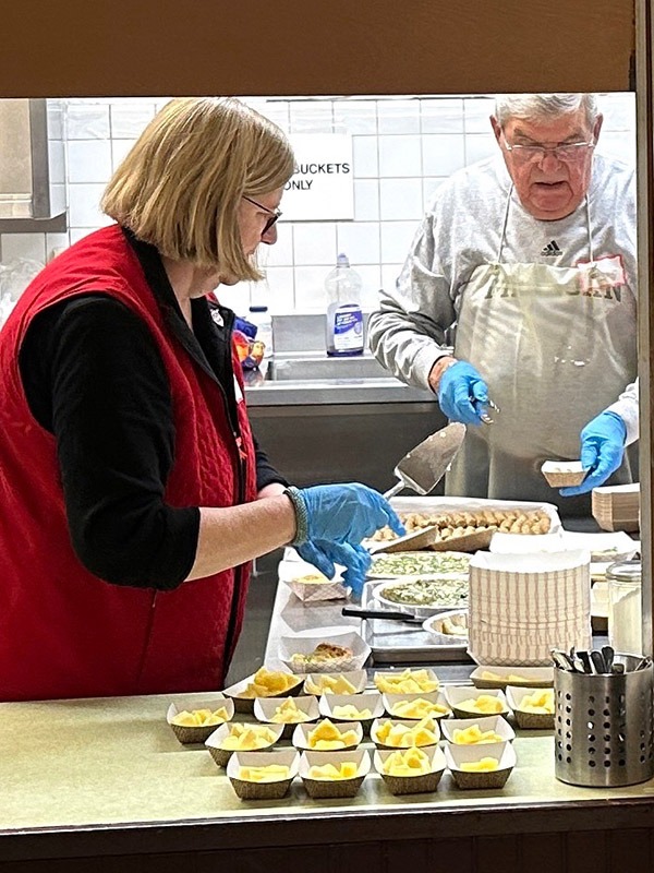 volunteers preparing food for Breakfast Program guests