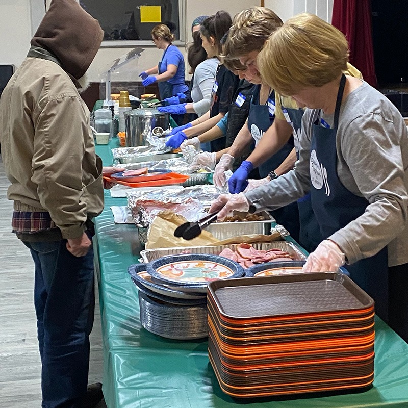 breakfast volunteers serving food